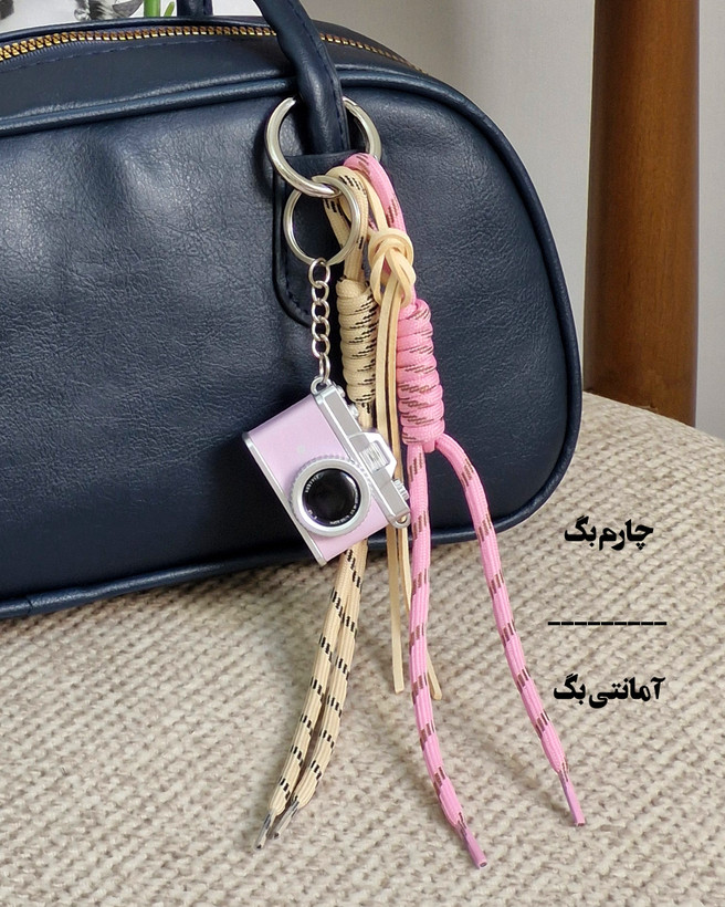 چارم بگ آویز کیف دوربین صورتی
